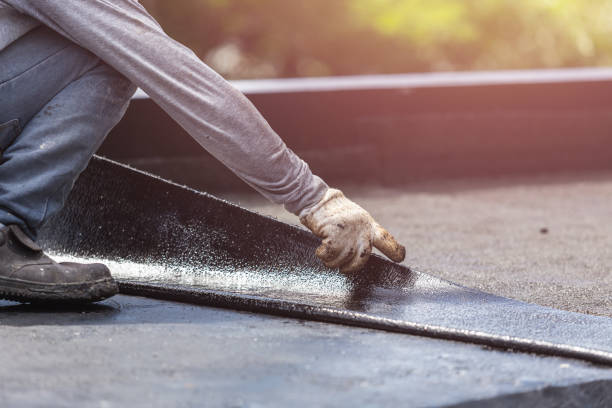 Professional Waterproofing technician working in Fall River, WI